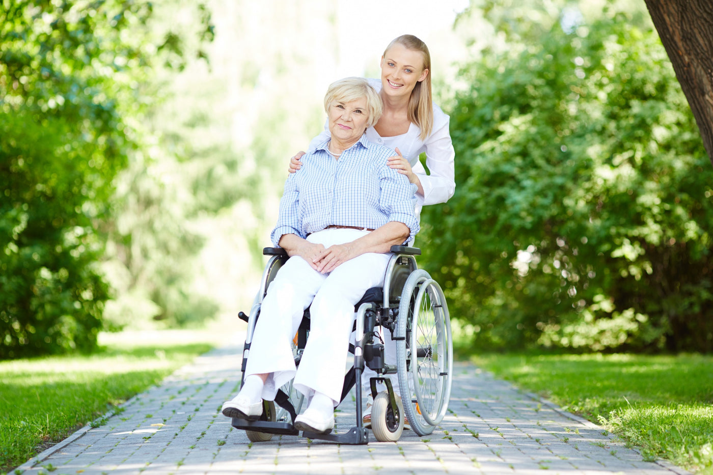 nurse-walking-with-senior-patient-wheelchair